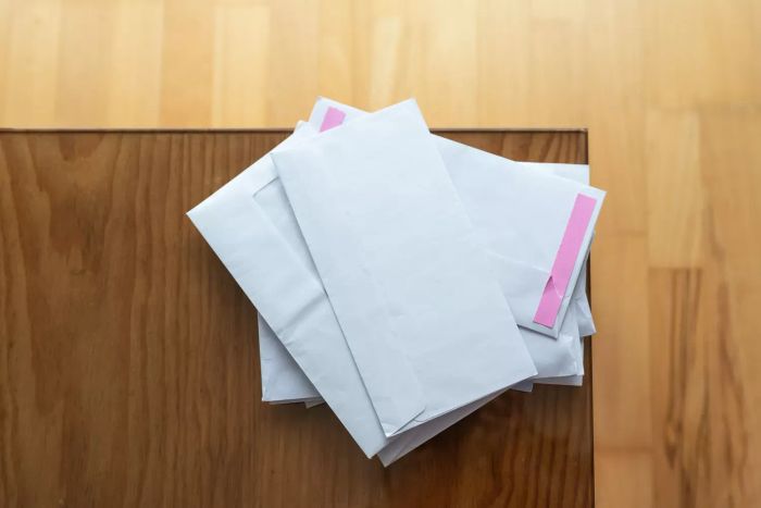 pile of mail on a countertop