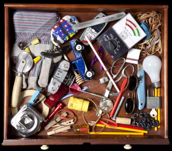 Assorted items in a junk drawer