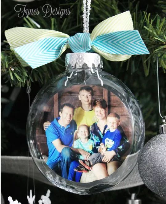 A glass ornament with a photo nestled inside.