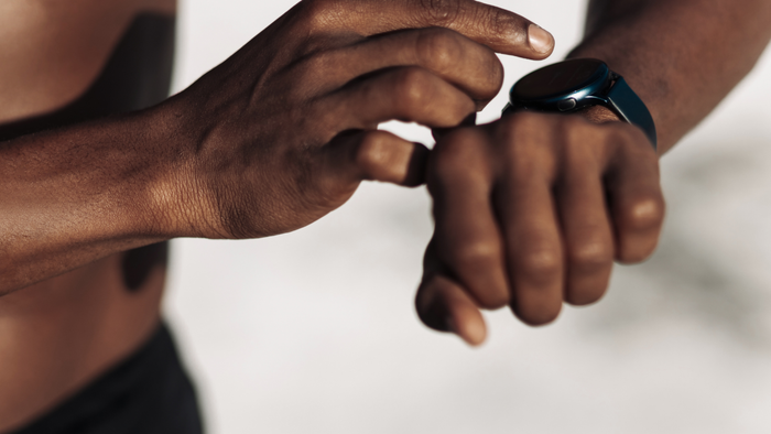 fitness tracker being taken off the wrist