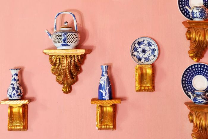 Delft pottery displayed on decorative pedestals