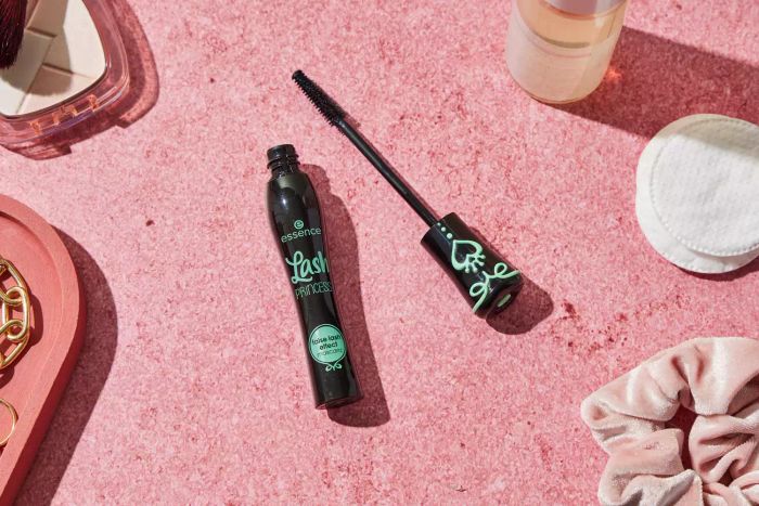 Essence Cosmetics Lash Princess False Lash Effect Mascara displayed on a soft pink countertop