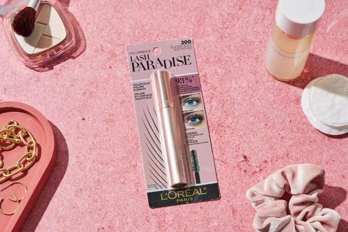 L'Oreal Lash Paradise Washable Mascara in its packaging, displayed on a pink background