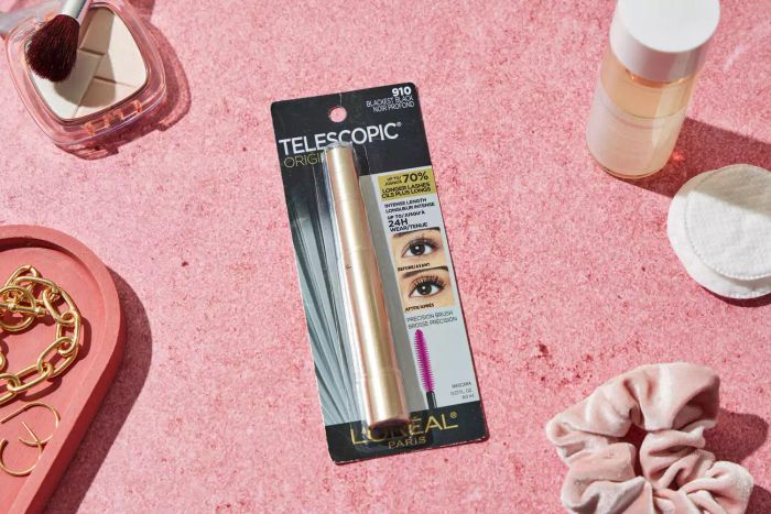 The packaging of L'Oréal Telescopic Original Washable Mascara set against a pink background