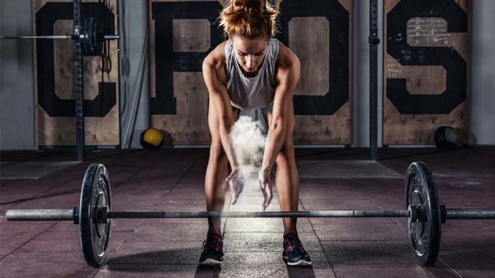 a person preparing to lift a barbell