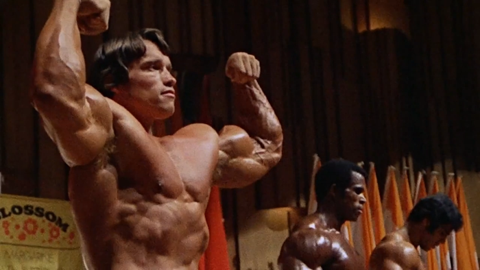 A photo of Arnold Schwarzenegger striking a pose from Pumping Iron