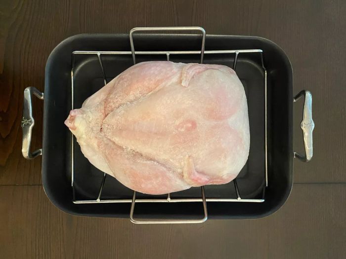Roasting a frozen Butterball turkey in a roasting pan from scratch.