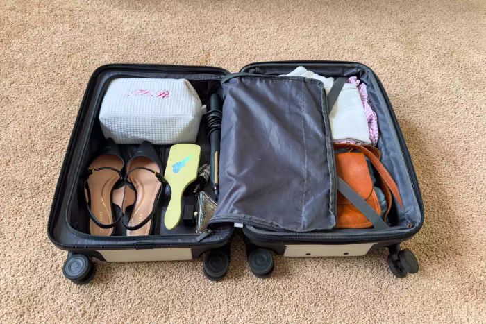Inside the Open Story Hardside Carry-On Spinner Suitcase, you'll find all the necessary compartments and details to help you stay organized while traveling.