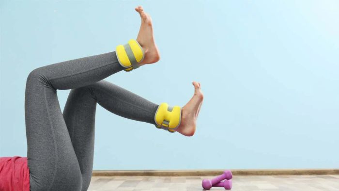 individual working out with ankle weights