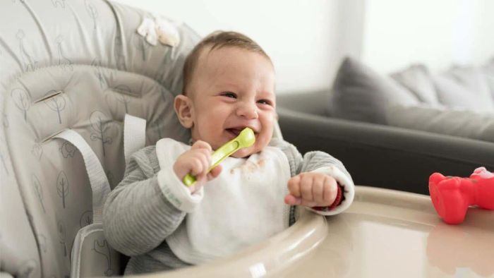 joyful baby enjoying a meal