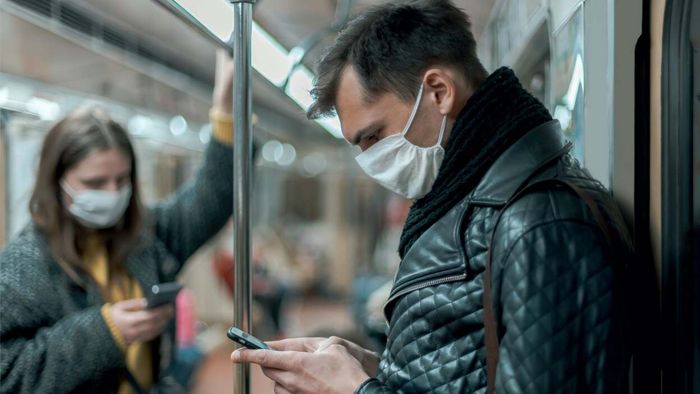 Commuters wearing masks on the subway