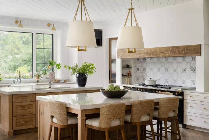 a bright, spacious kitchen showcasing a range alcove and natural wood accents