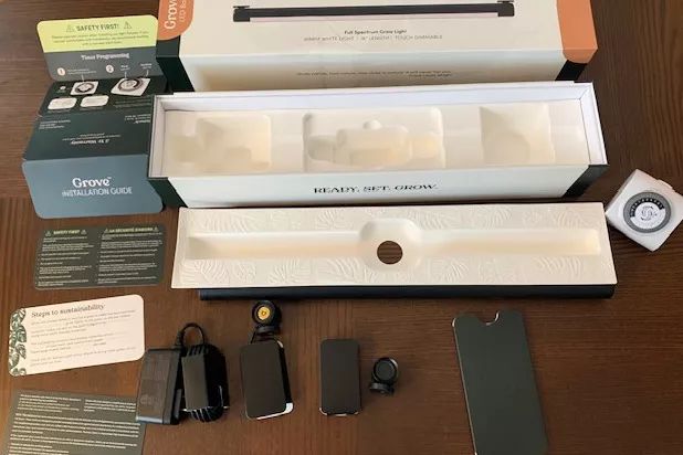 The original packaging of the Soltech Solutions Grove LED Grow Light displayed on a table.