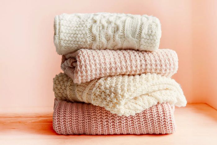 pile of wool sweaters