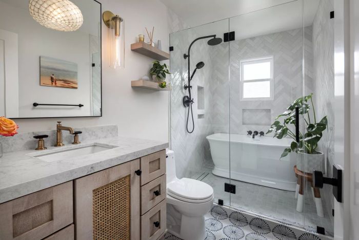 a bright bathroom with a narrow enclosed area housing a shower and bathtub
