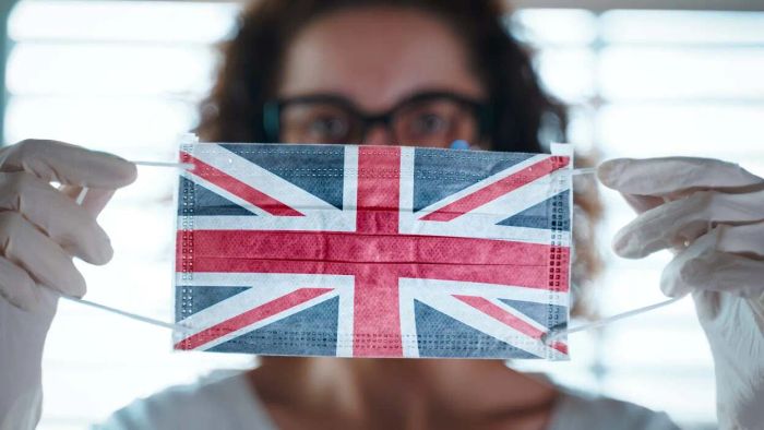 individual wearing a Union Jack-themed face mask
