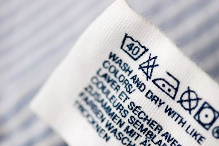 Clothing care labels featuring laundry symbols