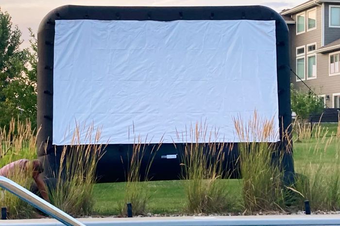 Vivohome 17ft Inflatable Mega Movie Projection Screen set up in a backyard