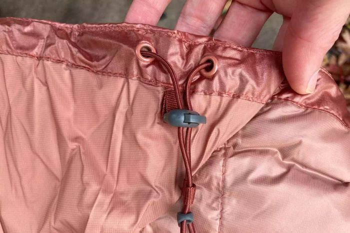 The adjustable drawstrings on the Outdoor Research Women's Helium Down Hoodie