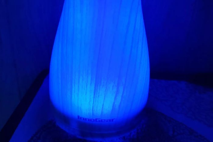 The InnoGear Essential Oil Diffuser illuminated with a soft blue glow