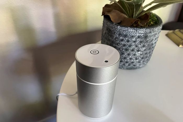 The Eco Nebulizing Diffuser placed on a white table
