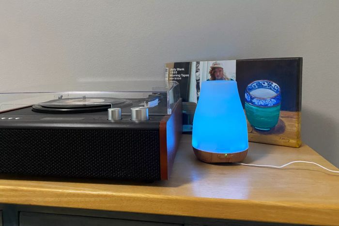 The Homeweeks Essential Oil Diffuser placed near a record player