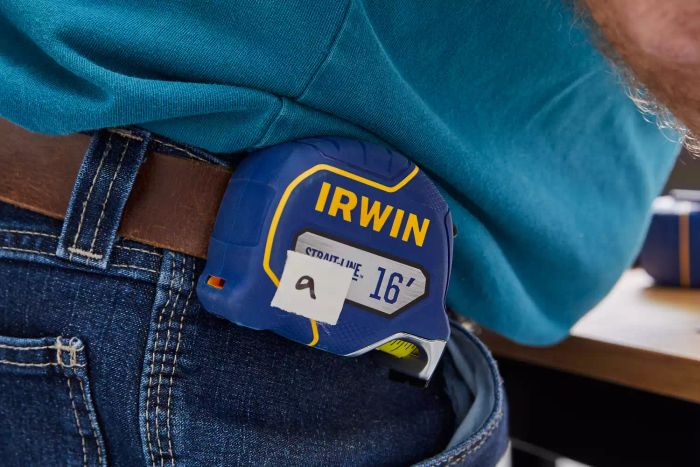 A person wearing an Irwin Strait-Line Tape Measure on a hip belt