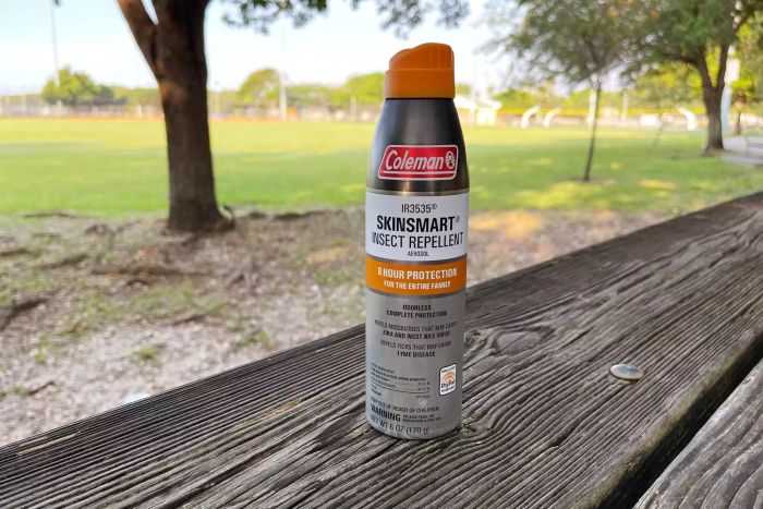 Coleman SkinSmart Insect Repellent Spray displayed on a wooden table