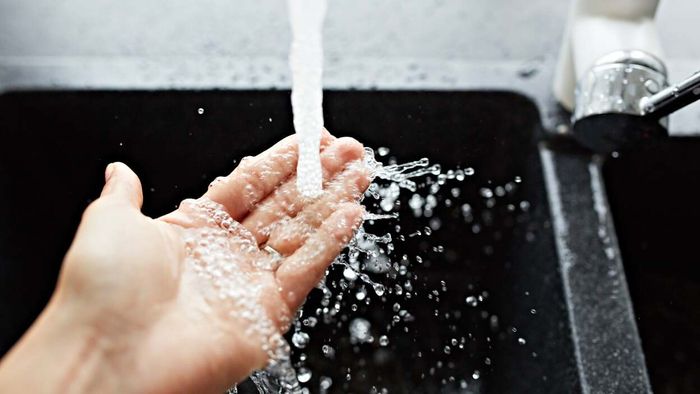 water dripping onto the hand