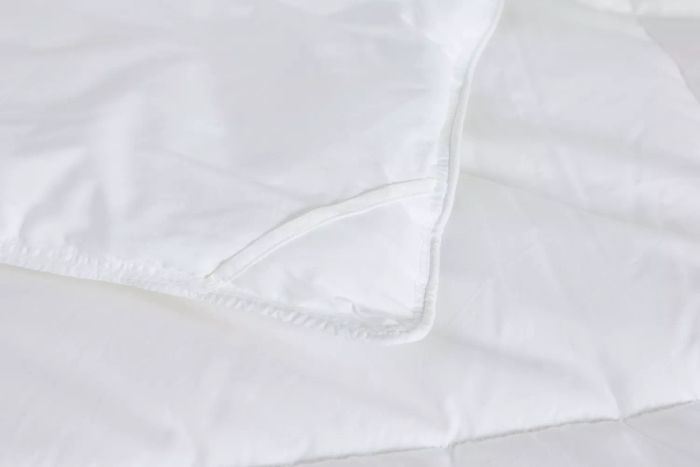 A detailed close-up of the corner stitching on the Riley Down Alternative Comforter