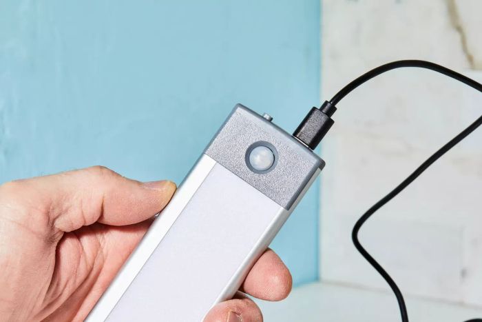 a close-up view of the Lepotec LED Motion Sensor Cabinet Light being charged