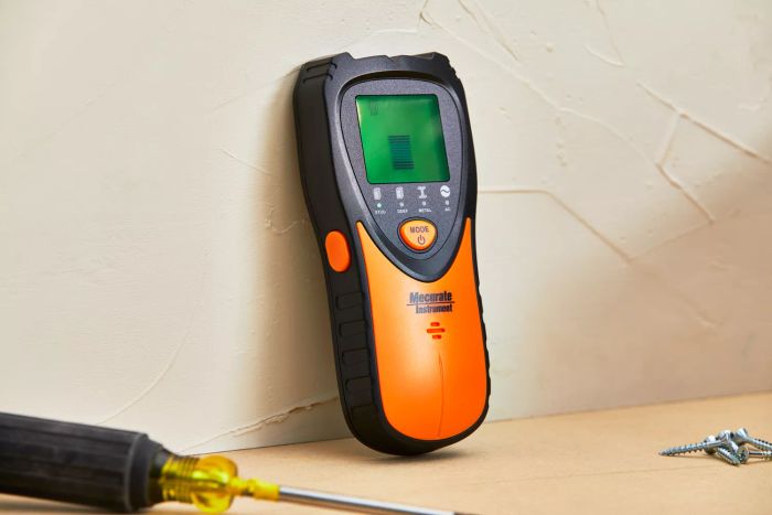 Mecurate Stud Finder Wall Scanner shown in use against a wall