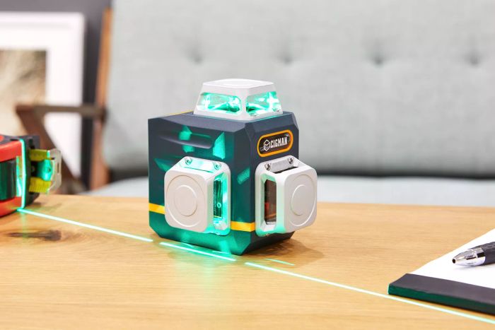 Cigman 3x360° Green Laser Level shown on a wooden surface while projecting the laser lines
