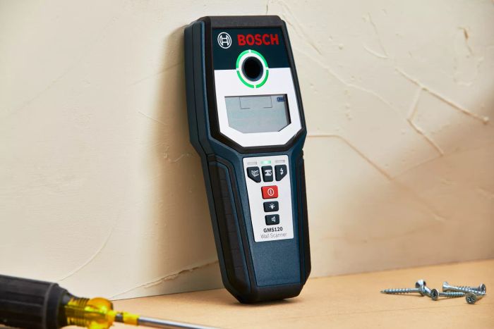 Bosch GMS120 Digital Multi-Scanner placed on a table alongside screws