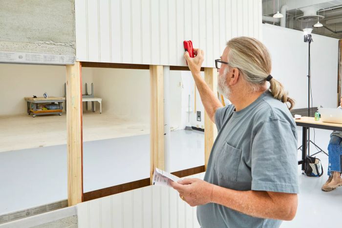 A person using the Craftsman 3/4-Inch Depth Stud Finder against a wall