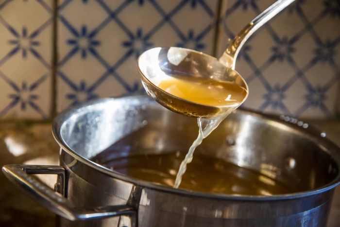 bone broth in ladle