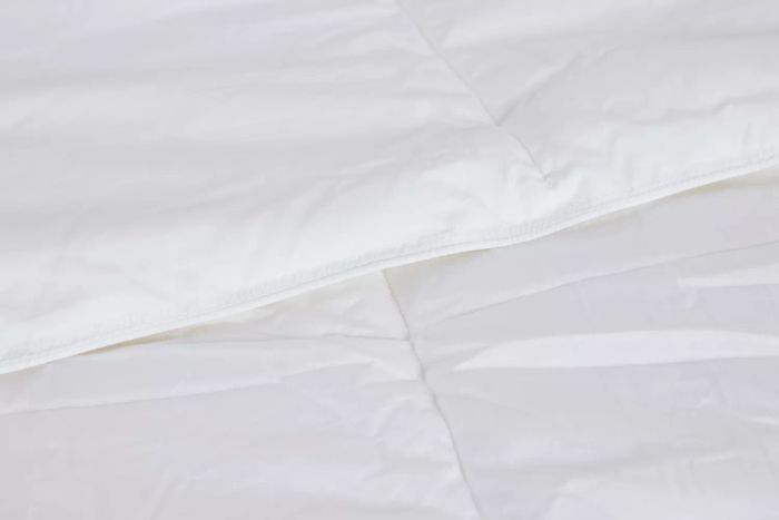 A detailed view of the edge stitching on the Riley Down Alternative Comforter