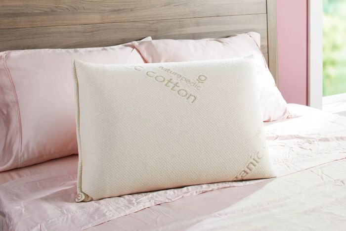 The Naturepedic Organic Solid Latex Pillow placed on a bed