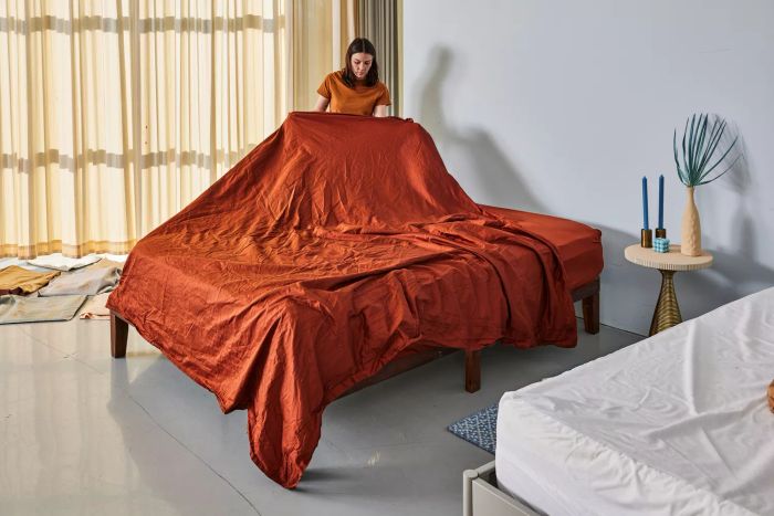 A person lifting a Miracle Made Sheet