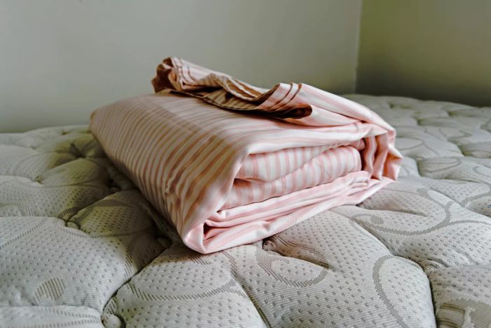 The Buffy Breeze Sheet Set neatly folded on a mattress
