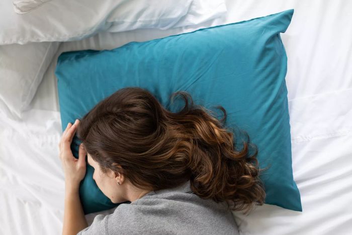 Person resting on the Weekender Gel Memory Foam Pillow