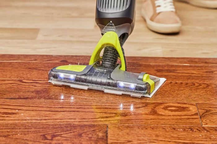 The Shark VM252 Vacmop Pro Cordless Wet/Dry Stick Vacuum efficiently cleans a hardwood floor