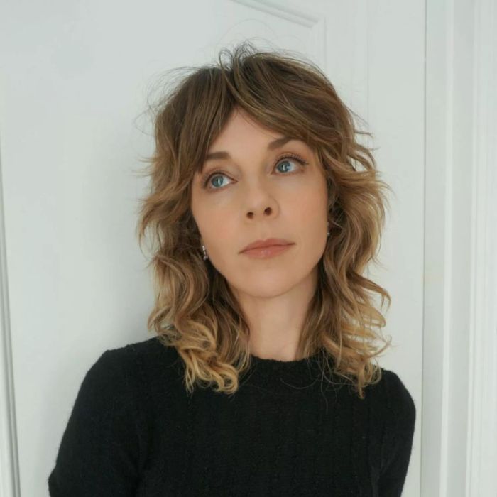 Medium-length shag haircut with textured layers.