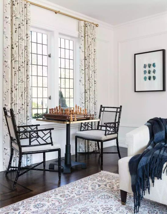 A living room with distinct separate areas.