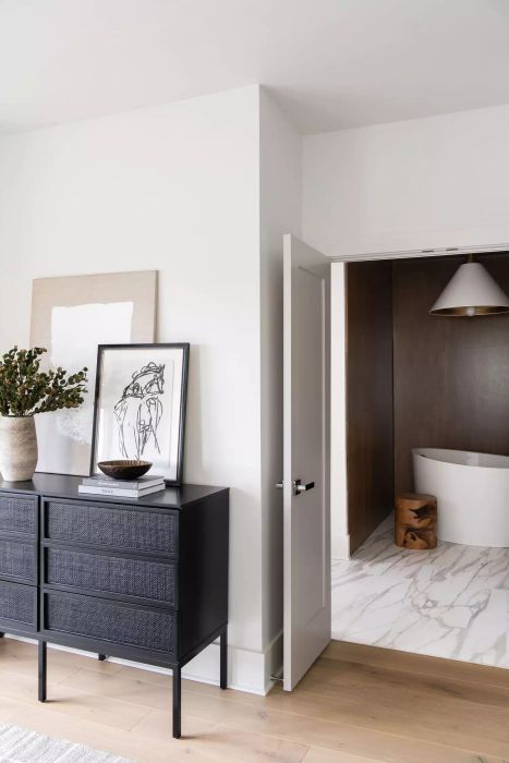 A dresser with elevated legs.