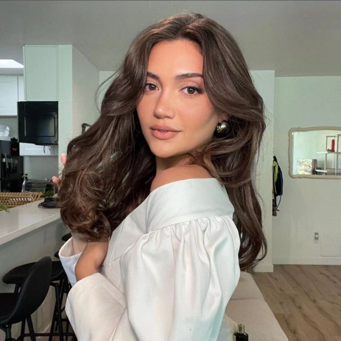 Medium-length, thick hair styled with rounded, voluminous layers.