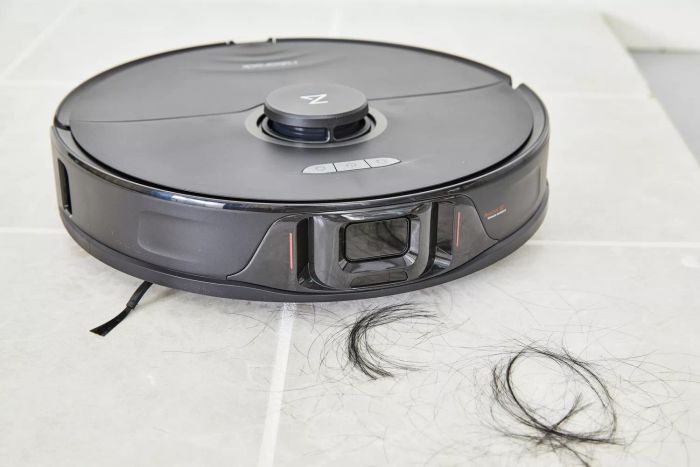 Roborock S8+ Robot Vacuum Mop removing hair from a tile floor