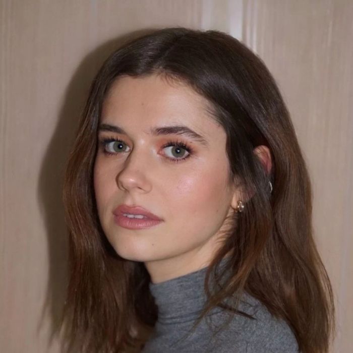 Short brown hair with a modern, textured finish.