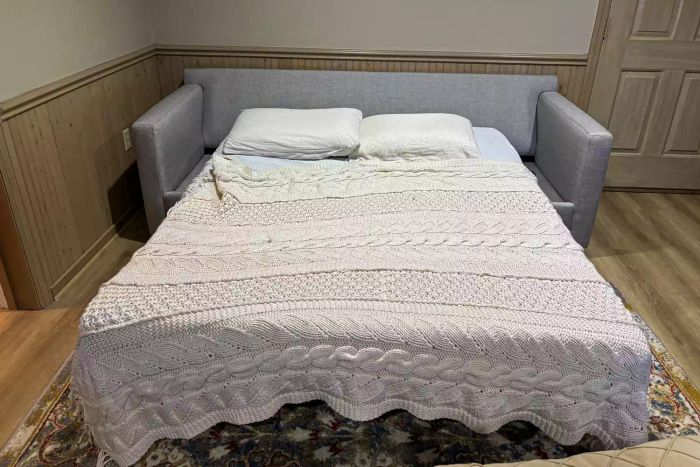 The Crate & Barrel Barrett II 3-Seat Queen Sleeper shown with the mattress fully extended
