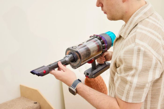 A person assembling the Dyson Gen5detect Cordless HEPA Vacuum.